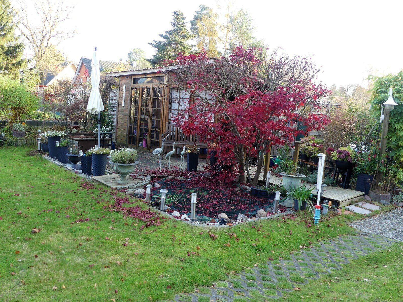 Gartenhaus mit Sitzplatz Wohnu