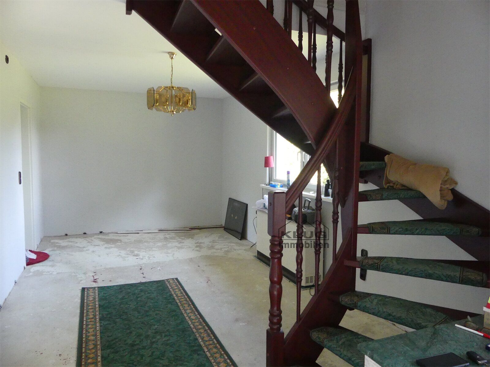 Wohnbereich mit Treppe zum DG