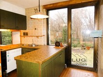 12 - Einbauküche mit Ausgang zum Ga